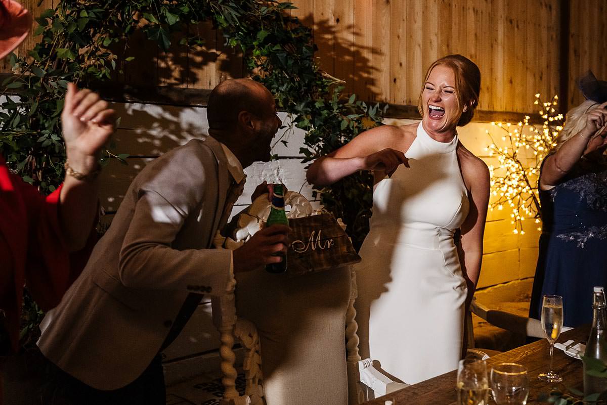 bride laughing at the groom The Wellbeing Farm wedding