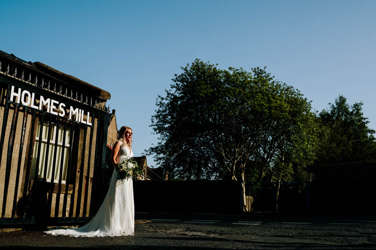 outside Holmes Mill gates portrait photography