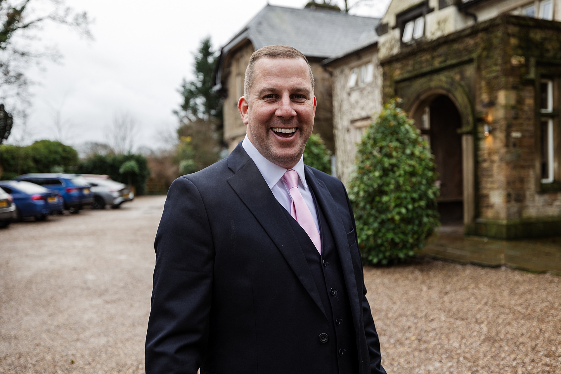 Groomsmen Mitton Hall wedding venue morning groom smiling