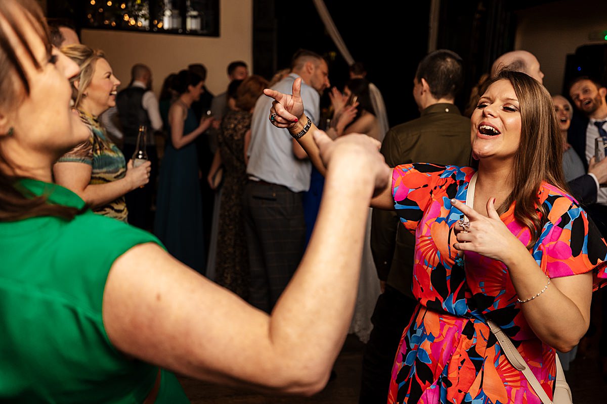 dancing wedding guests bride groom singing evening 