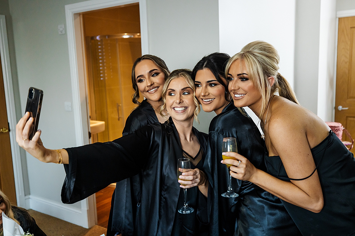 girls posing for a camera villa wrea green bridal party