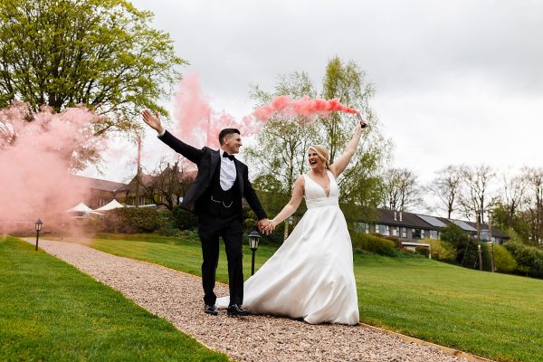 stirk house lancashire ribble valley wedding bride groom smoke bomb