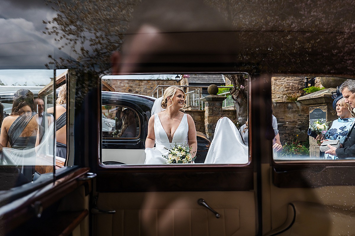 leaving Stirk House Luxury hotel Wedding in wedding cars