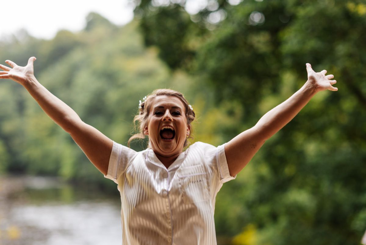 bride excited to get married hidden river barn wedding venue