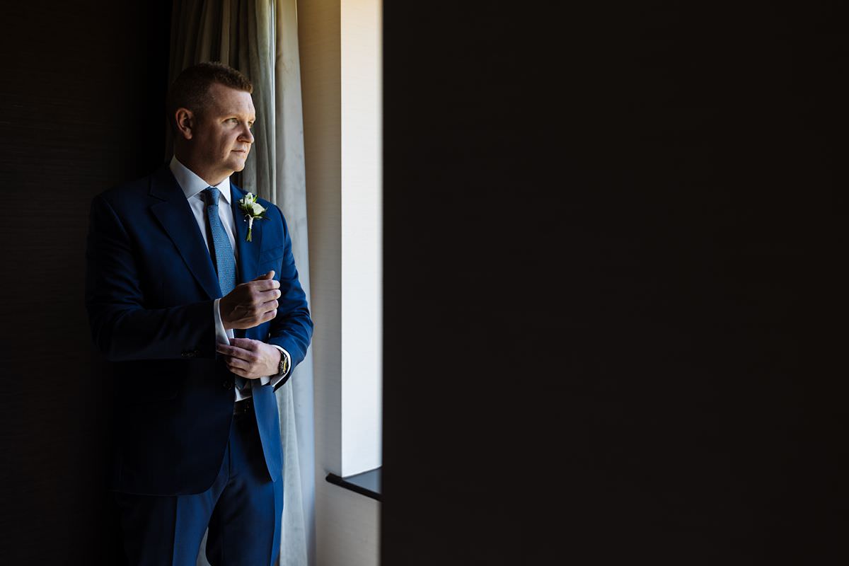 Groom portrait in the window at Stanley House Wedding Photography Venue 