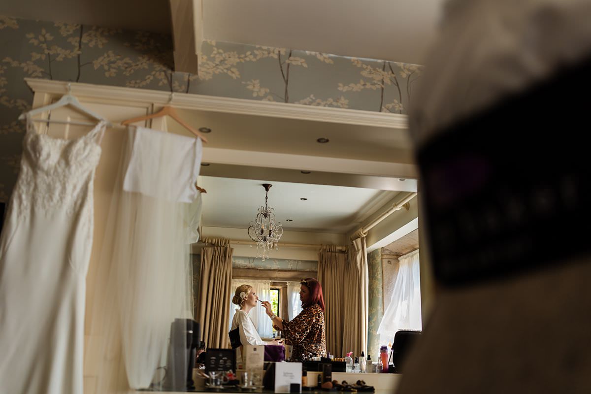 Bride getting her makeup done at Stanley House Wedding Photography Venue 