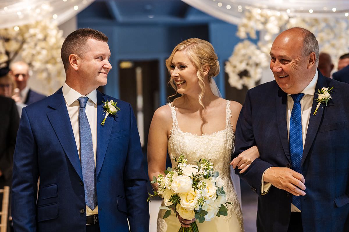 Bride meeting her Groom at the later with her Dad at Stanley House Wedding Photography Venue 