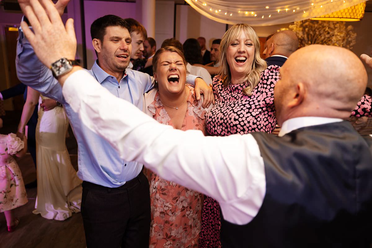 wedding guests celebrating for the first dance Stanley house Wedding Photography Venue 