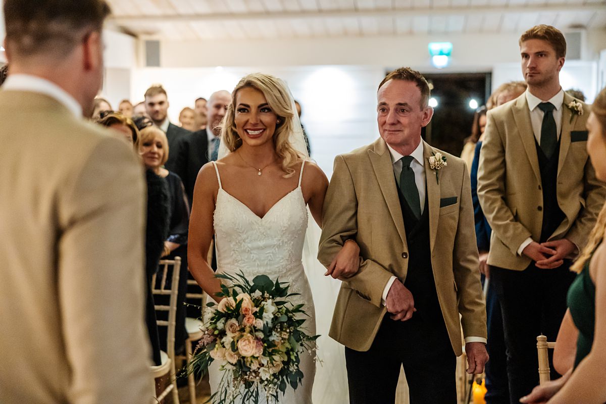 bride ceremoney dad groom smiles love bashall barn 