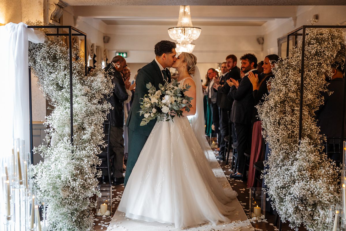 groom and bride married walking down the aisle at Bartle Hall