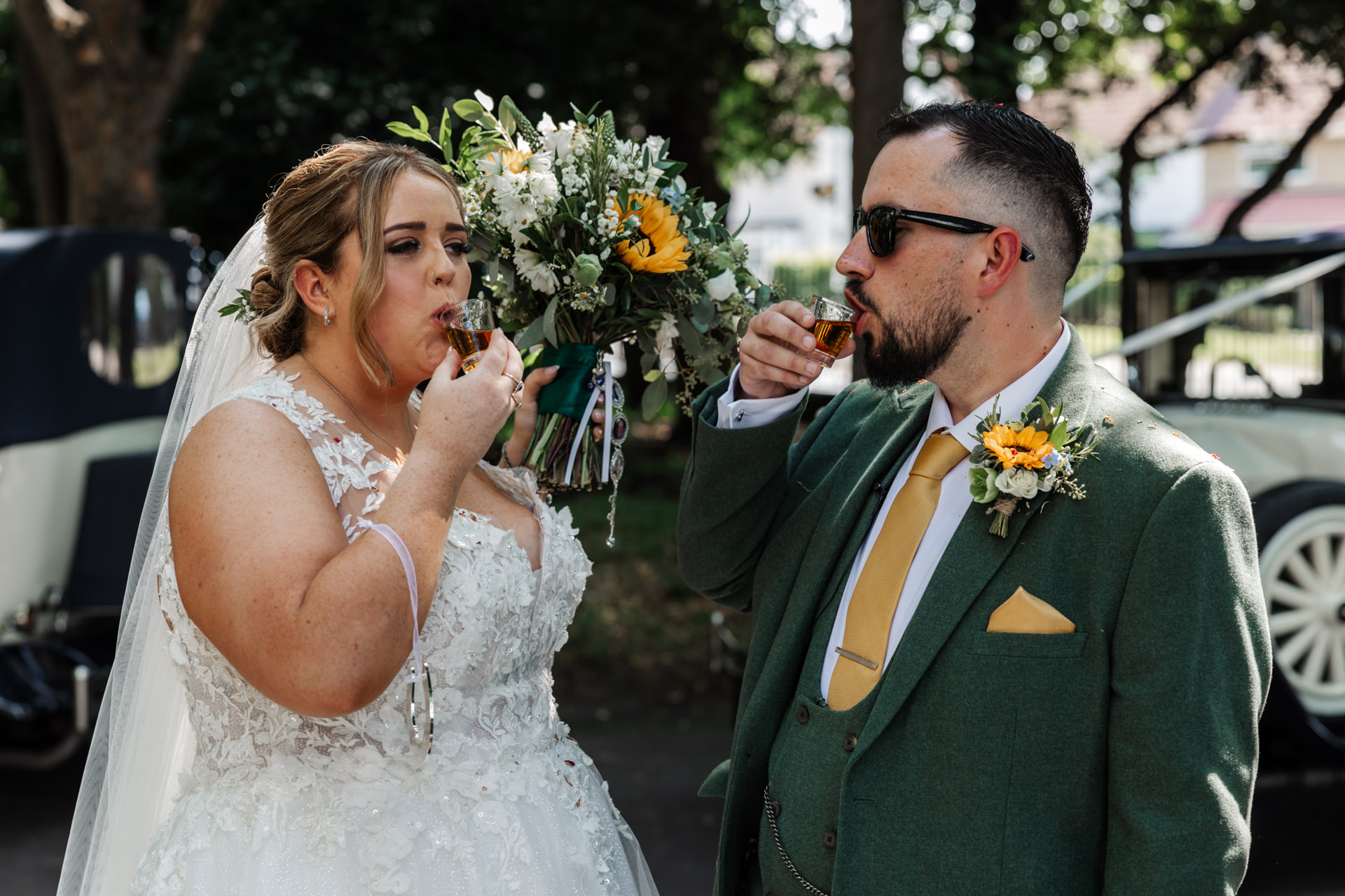 bride groom celebrating with a shot of alcohol West Tower
