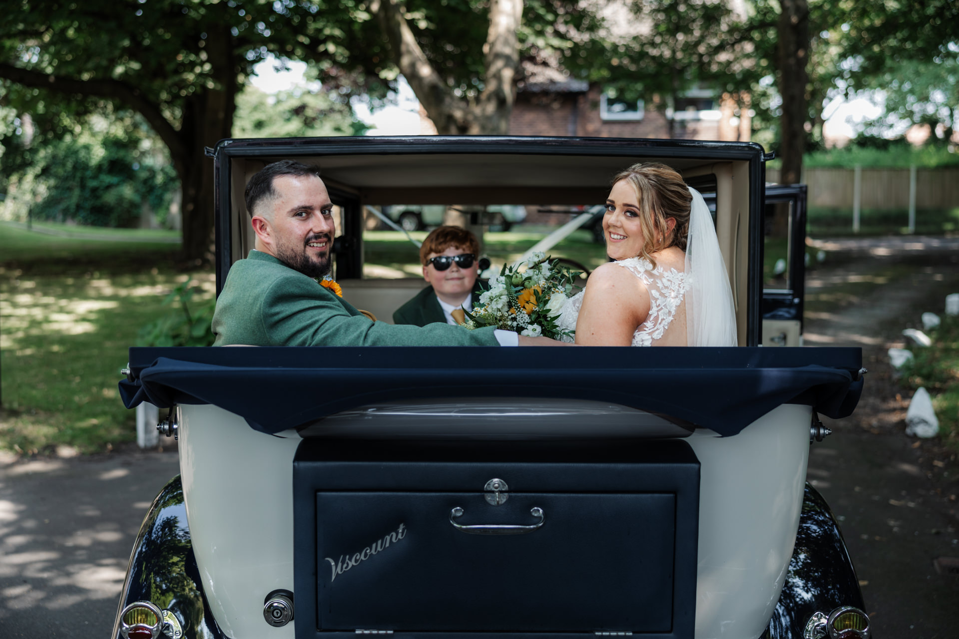 wedding car bride groom heading to the West Tower wedding venue