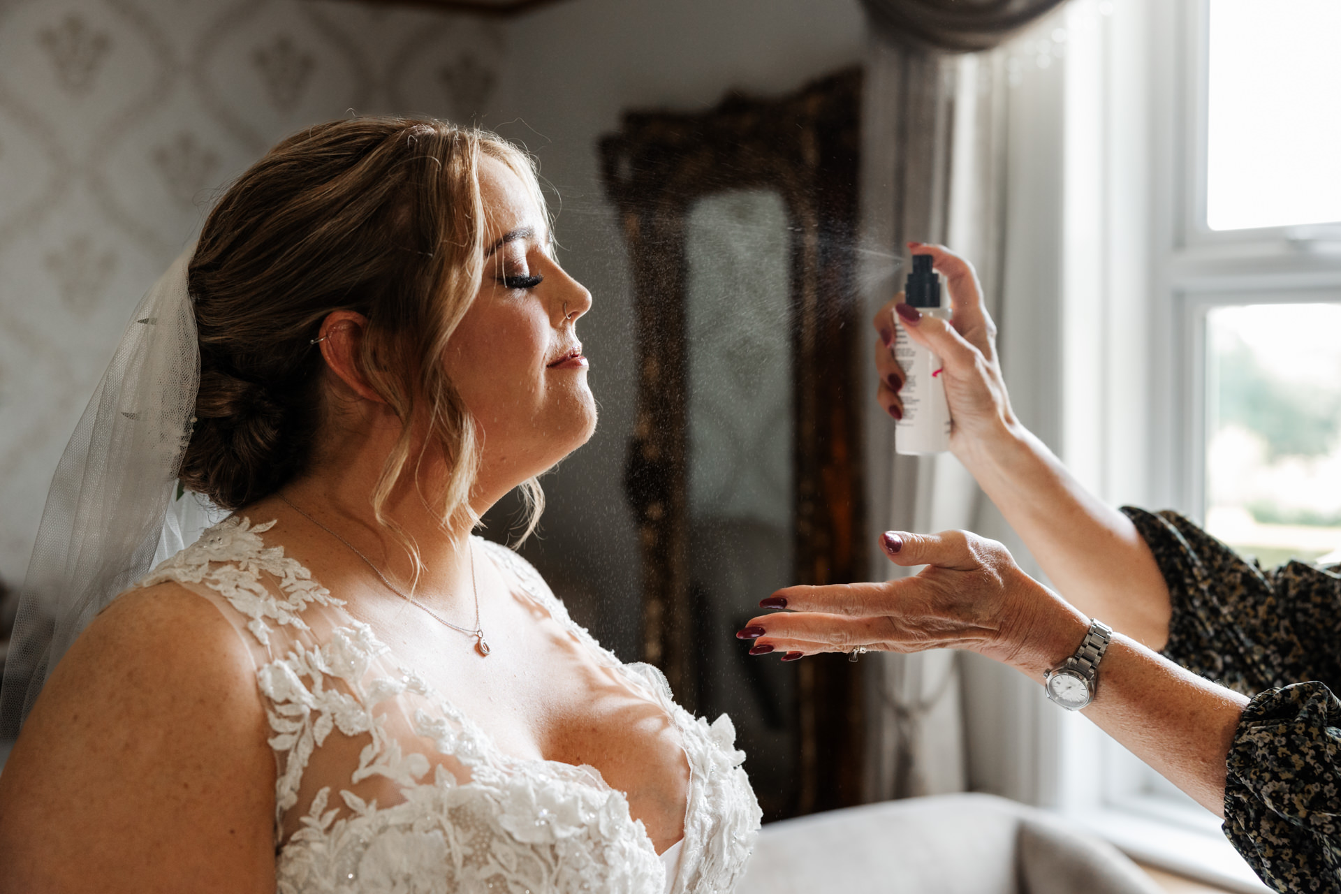 makeup artist final touches for the bride before ceremony West Tower
