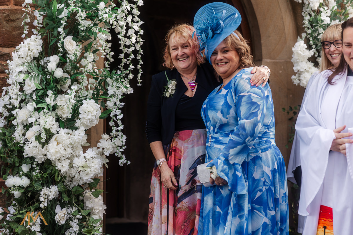 hugs parents church Bashall Barn wedding venue