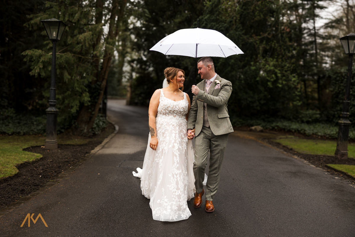 bartle hall wedding photographer portraits raining umbrella