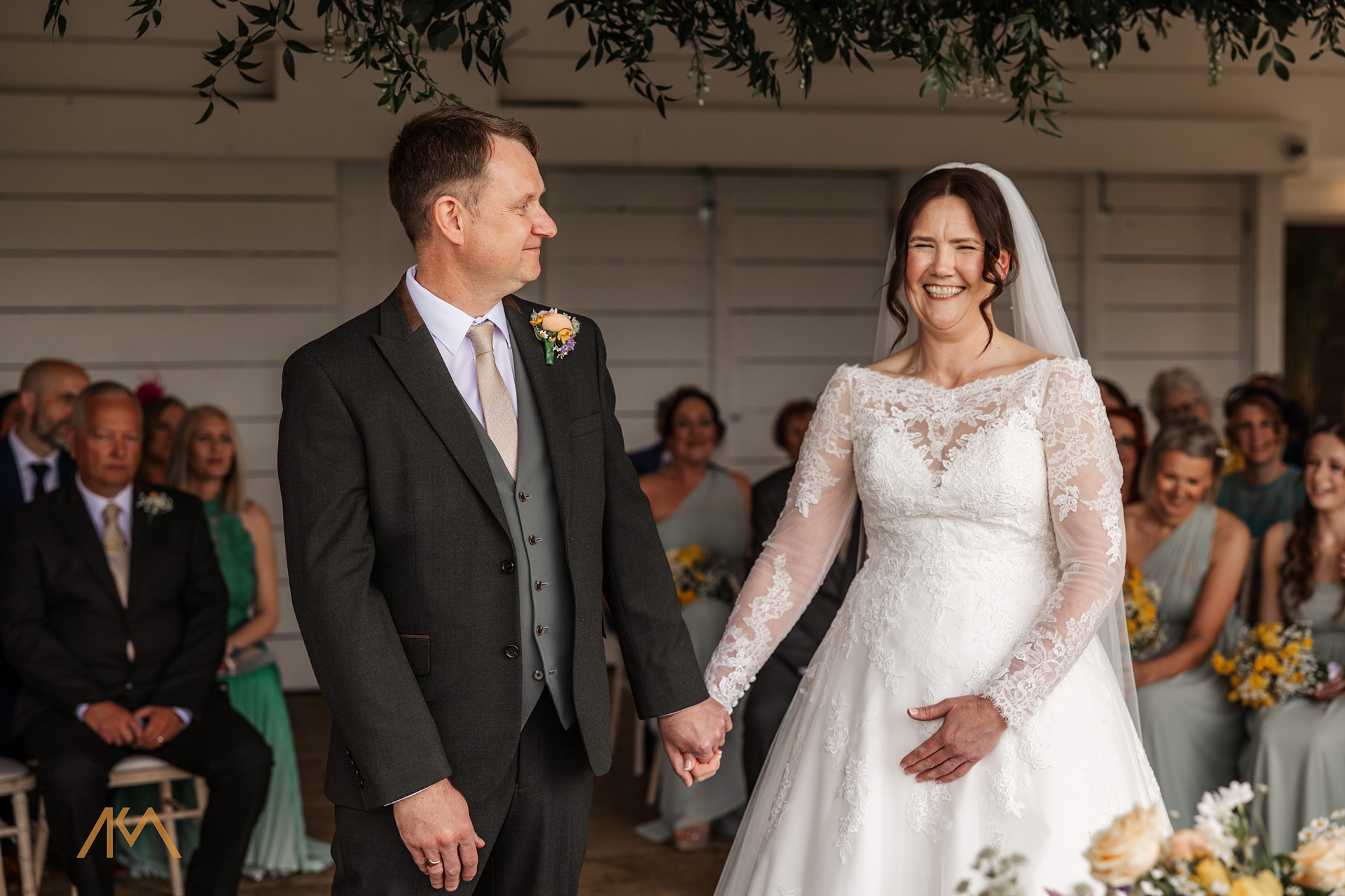 bride laughter groom smiles bashall barn