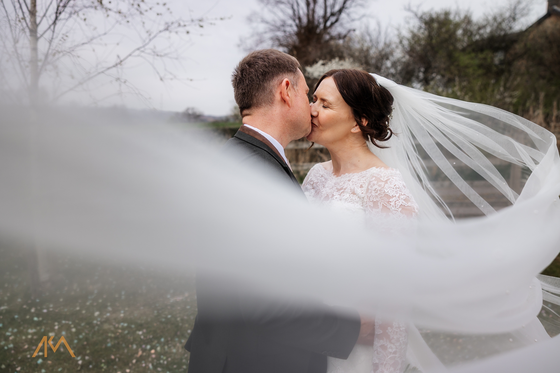 vale bride groom kissing bashall barn