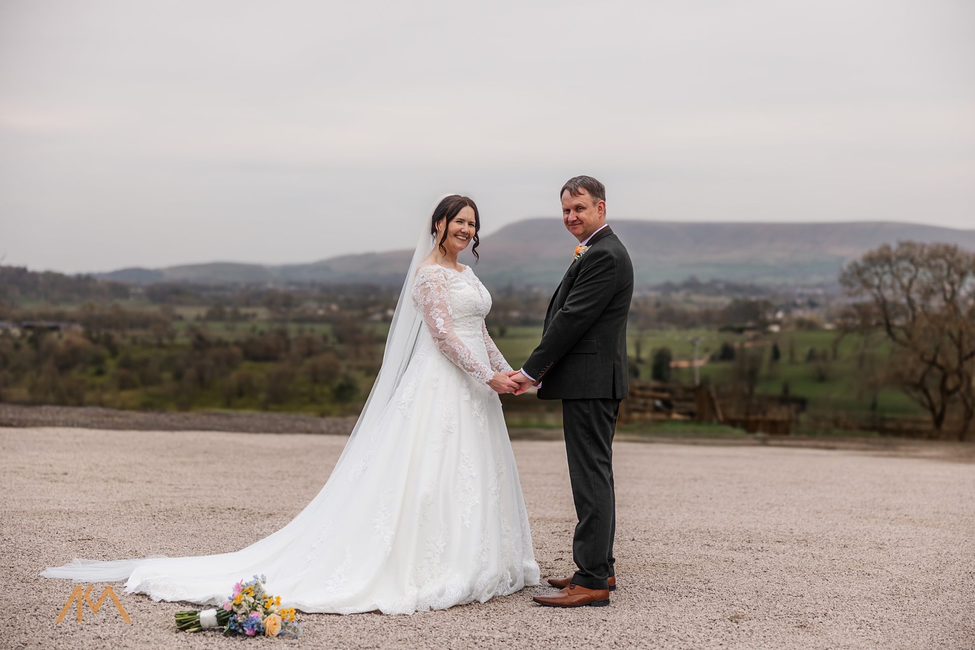 pendle hill wedding bashall bride groom smiles flkowers